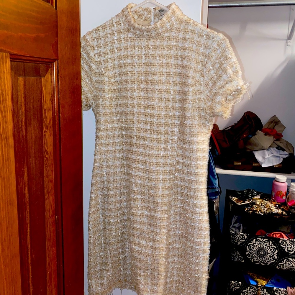 Knitted mock neck fitted dress. Subtle sequins.